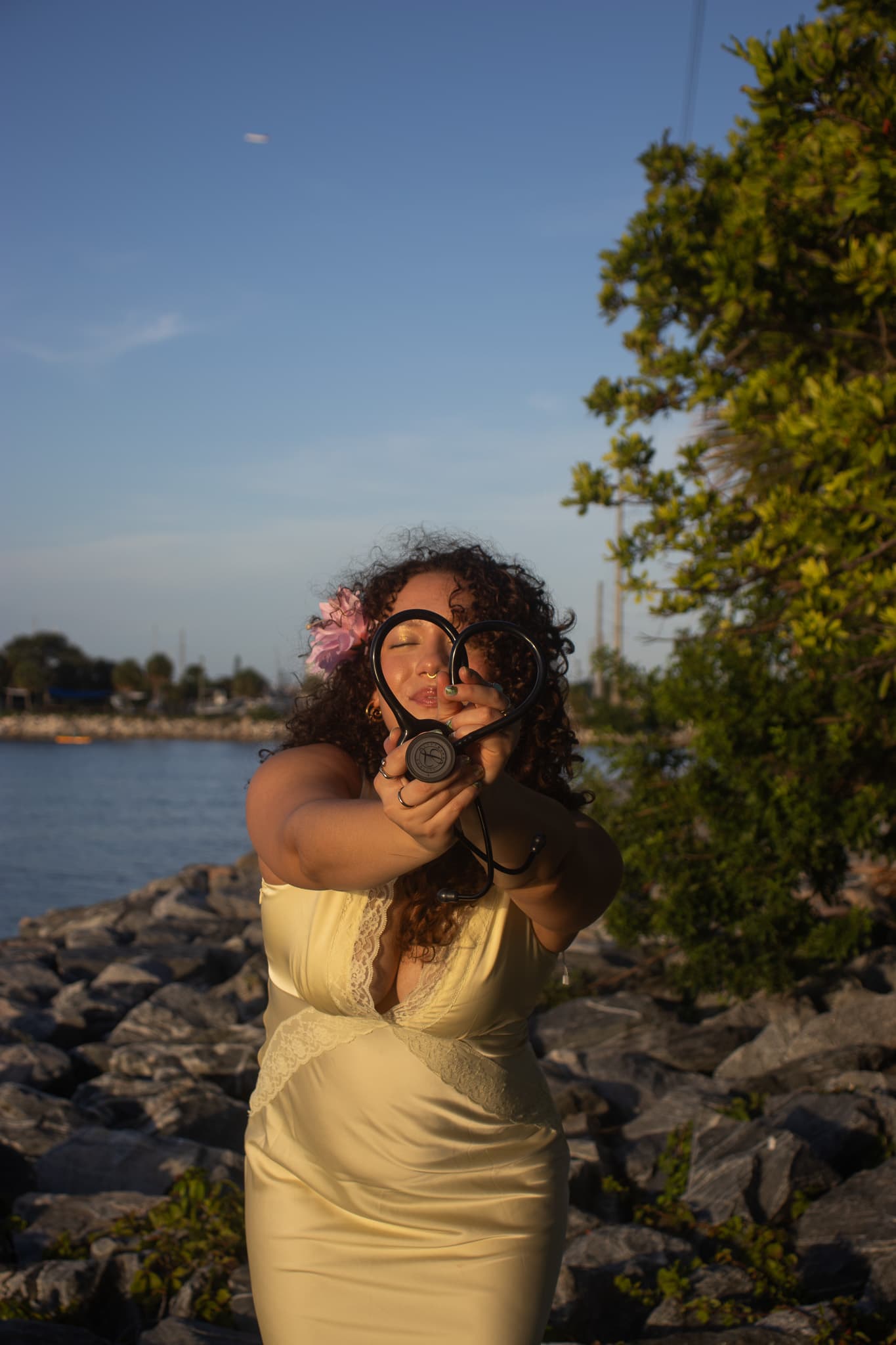 Nursing graduate holding a heart-shaped stethoscope during a Melbourne Florida graduation session
